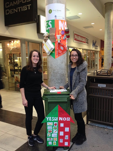 Amber and Alicia next to their waste bin design