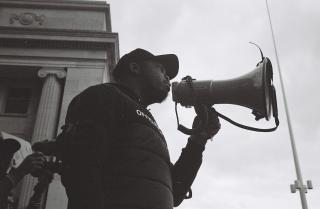I took this image on black and white film at the first Birmingham Black Lives Matter protest in the summer of 2020. The man pictured stood up in front of thousands and addressed the crowd, and I was lucky enough to be right next to him when he did. The wider importance of the BLM movement goes without saying, but for me personally, this exact moment gave me more hope than anything since the onset of COVID-19. I had become increasingly disillusioned with wider society in Britain, but seeing this man stand up