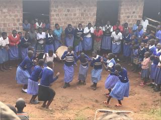 This image was taken at Kanjobe Junior School, Uganda. This photo represents the epitome of community to me as all the children of the school joined together in their beautiful local dance. 