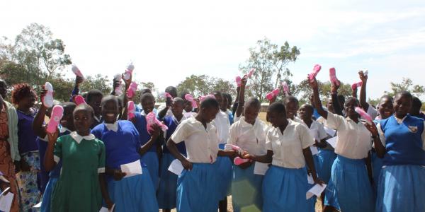 School girls holding Lilypads products