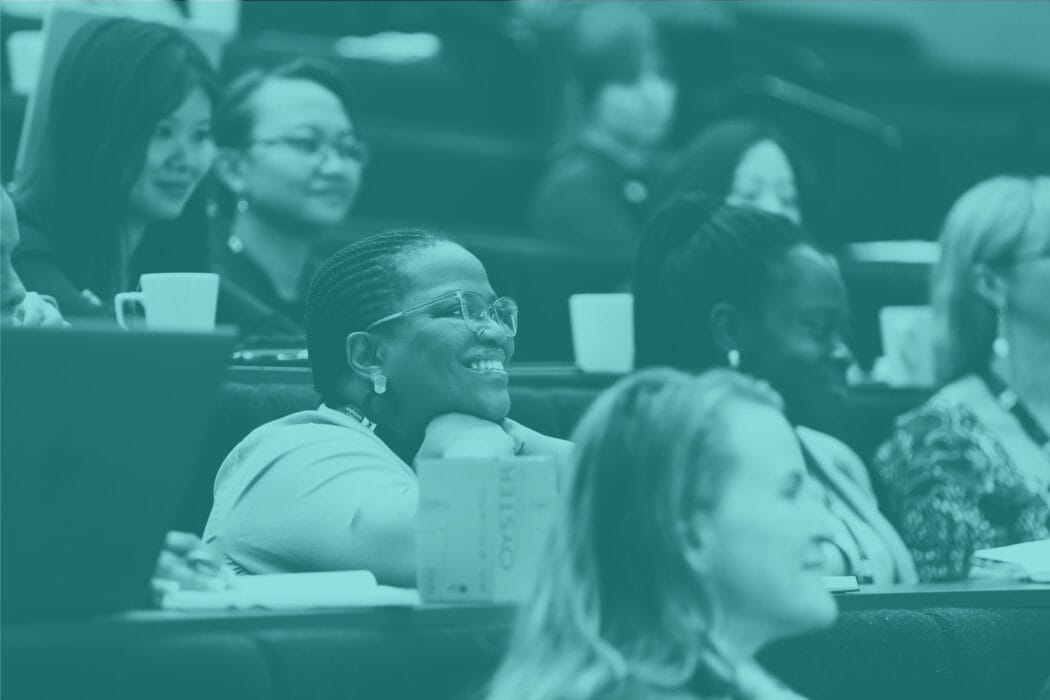 Image of researchers sitting in a lecture theatre