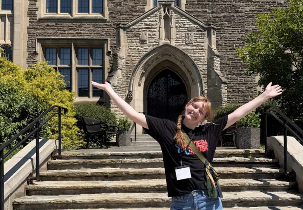 School for Sustainable Policy Leadership Student, Judi Eppele, standing outside a building